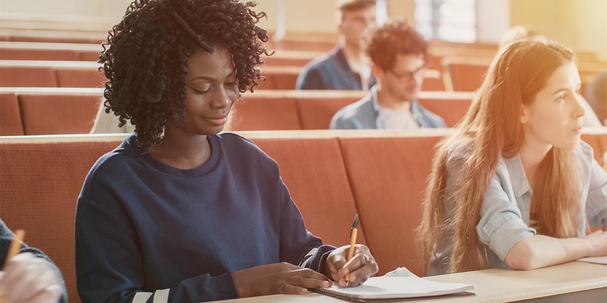 Students in a classroom taking notes.